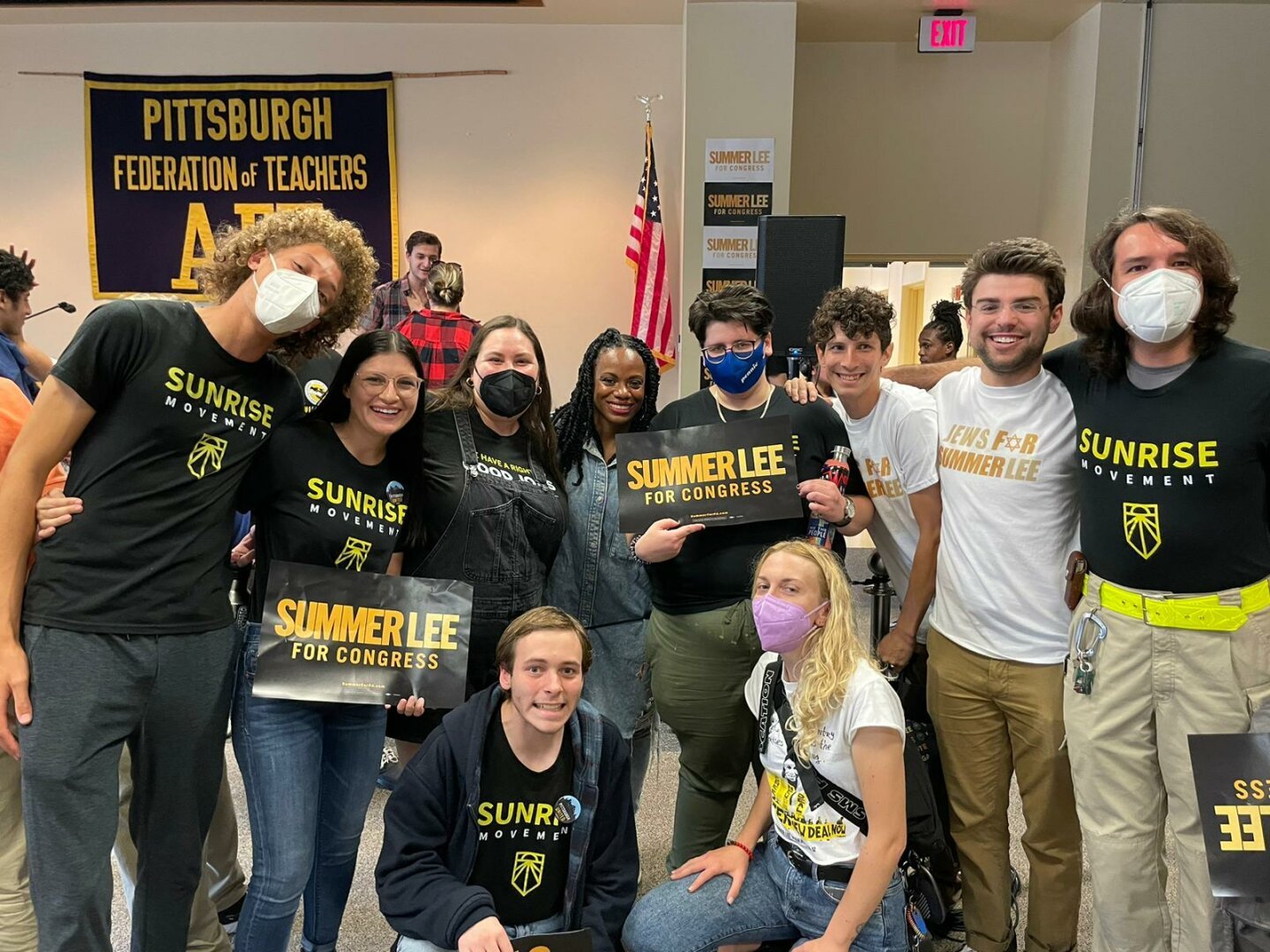 Summer Lee in the middle of a group of organizers wearing Sunrise Movement shirts. I'm all the way on the right, with a reflective belt