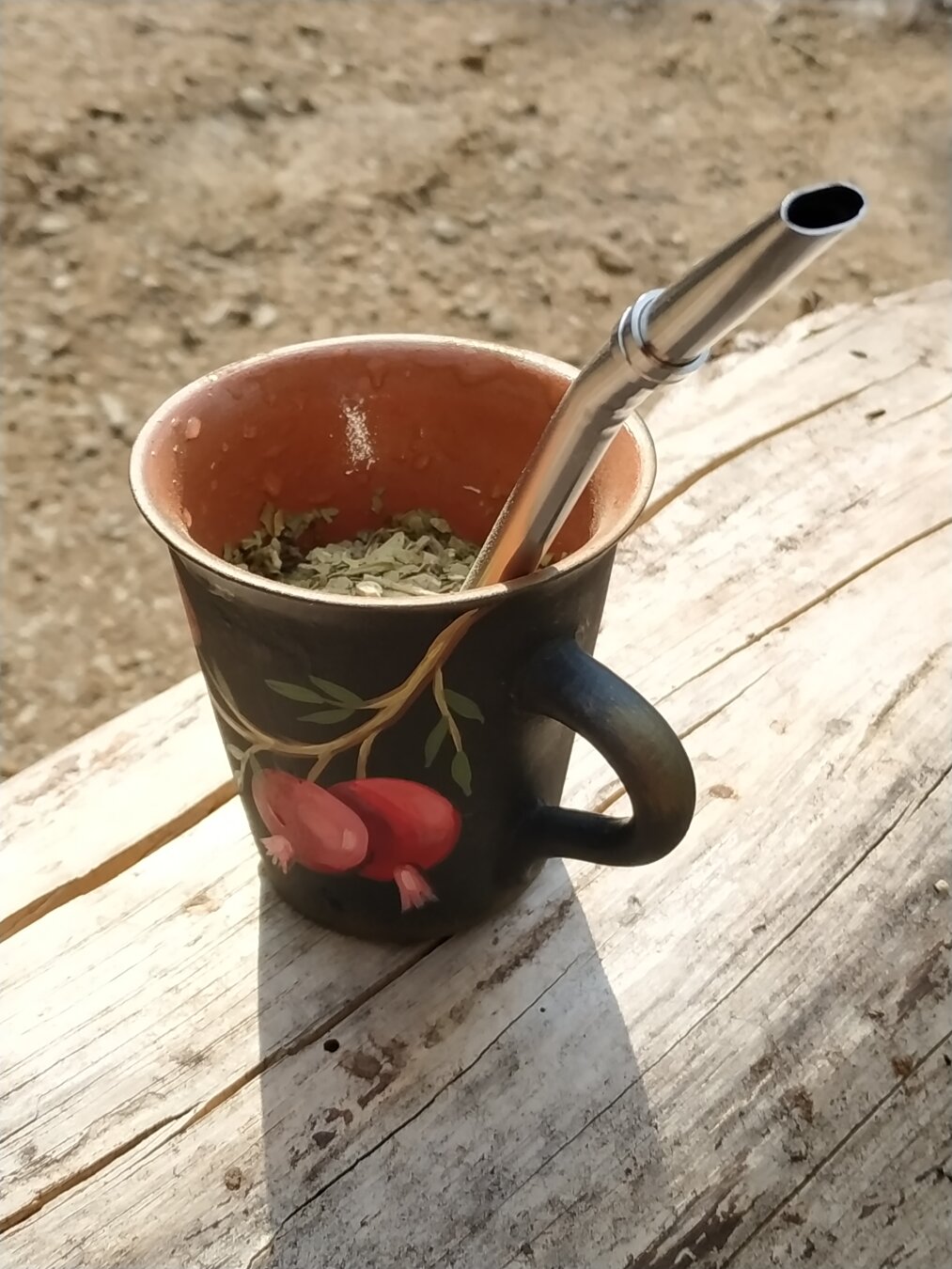 Yerba mate brewed in a hand-made cup painted with Georgian traditional motif.