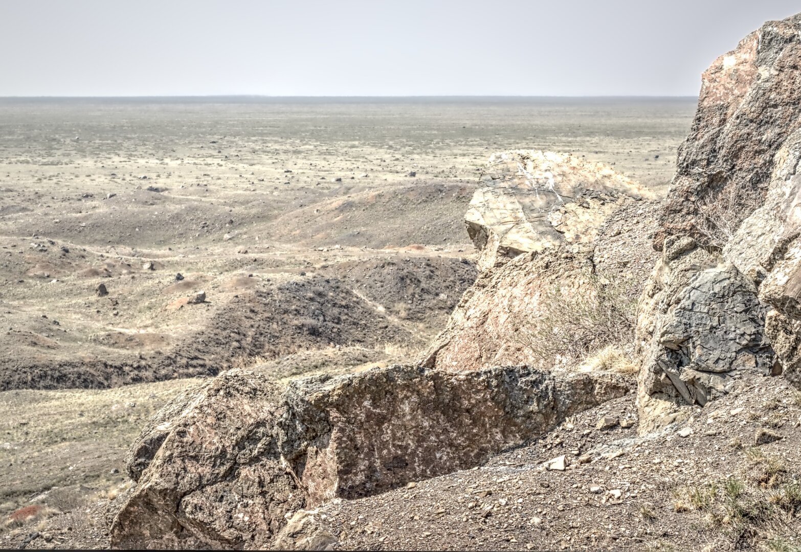 A view across the Kazakh steppe from the rocks, rubble and mounds of earth uprooted by a huge nuclear explosion in 1965