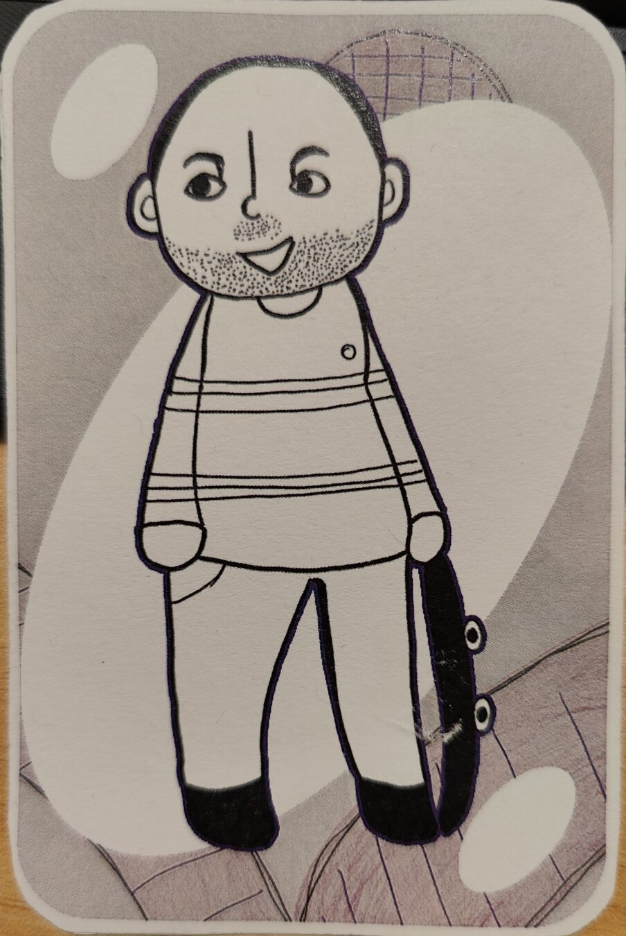 An Uno card, depicting a hand-drawn representation of me holding a skateboard.