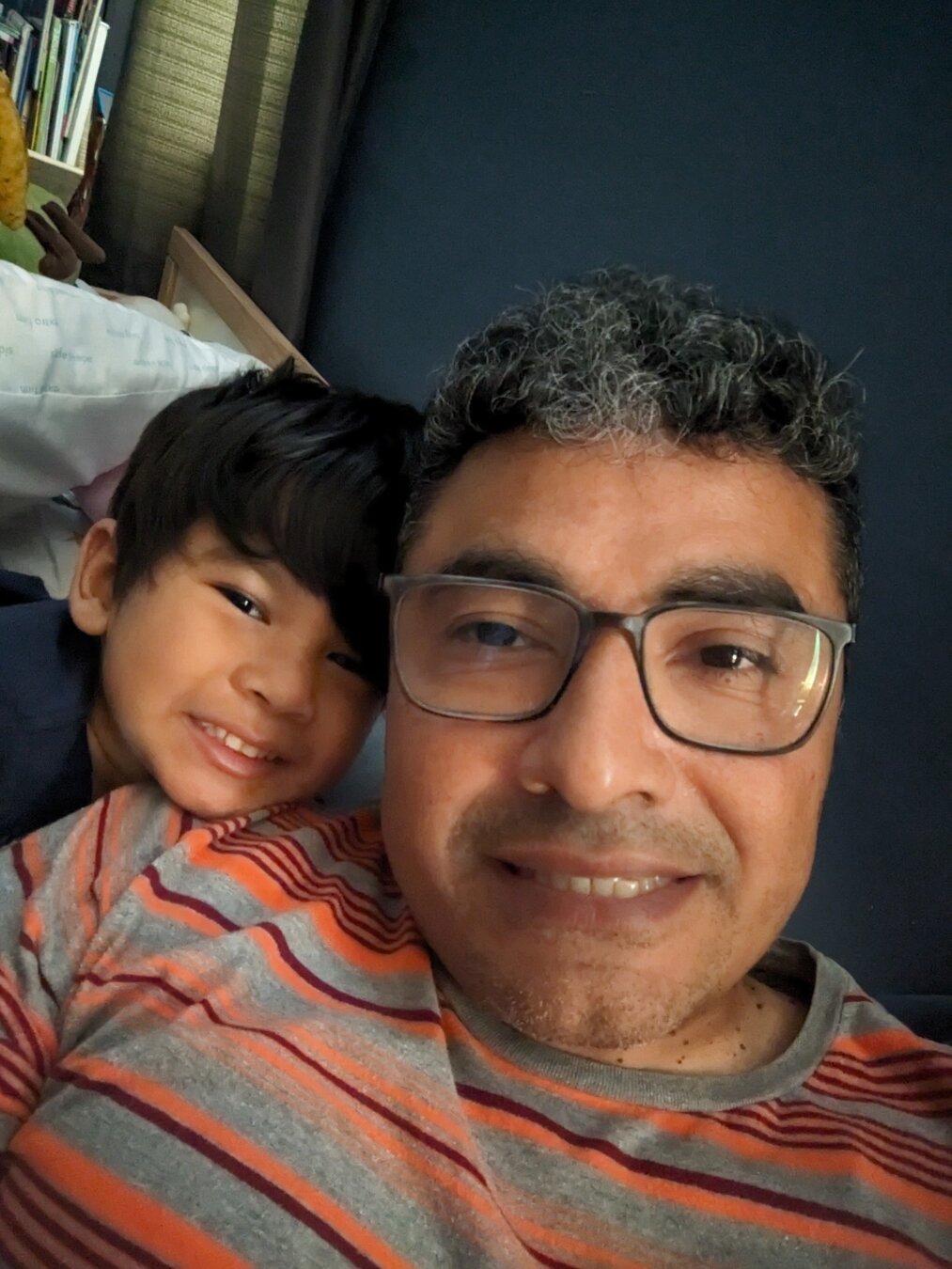 Selfie of me and my son. He is behind me on my shoulder.