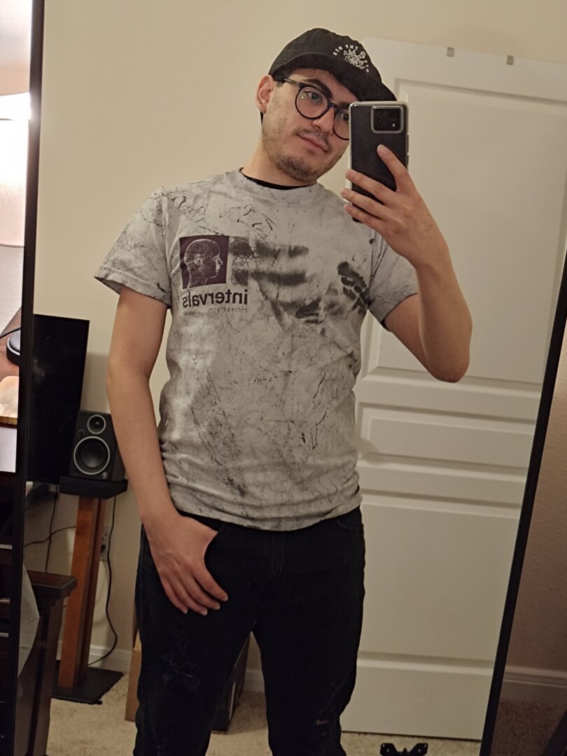 Selfie of the front of my gray Intervals "Neurogensis" band T-shirt