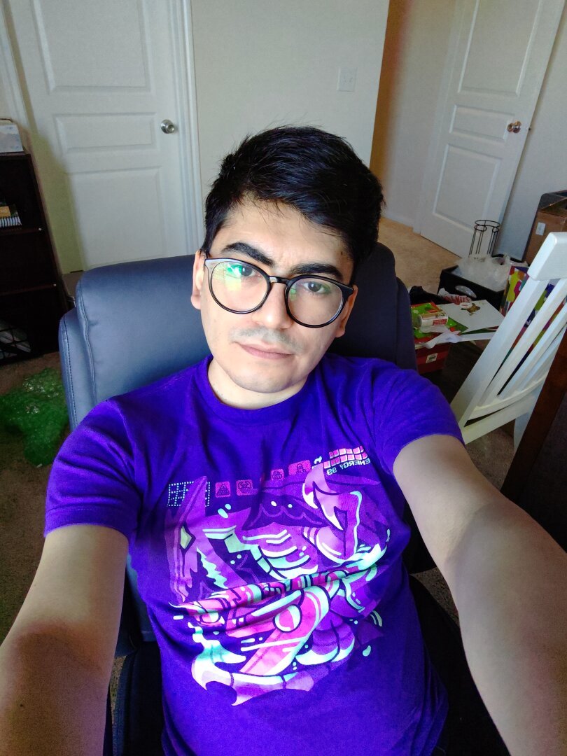 Showing my new Metroid shirt, it is bright purple, with Samus fighting Ridley in a stylized cartoon