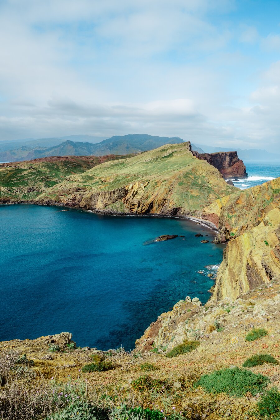 Green hilly peninsula, a bay with crystal turquoise water. Green hilly peninsula, a bay with crystal turquoise water.