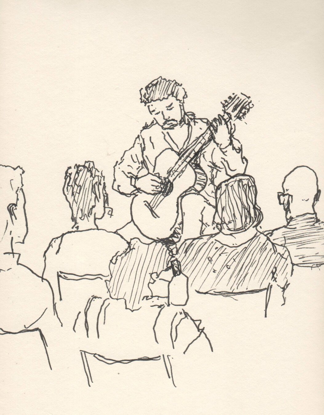 Pen drawing on light toned paper, it's mostly lines with little shading, in the foreground we see the audience (6 people appear in the frame of the drawing) with their backs towards us, and in front of them, Luciano, a guy probably around his thirties, with mustache and beard, plays the guitar, his eyes are almost closed in concentration, the instrument arm is raised high on his left leg.