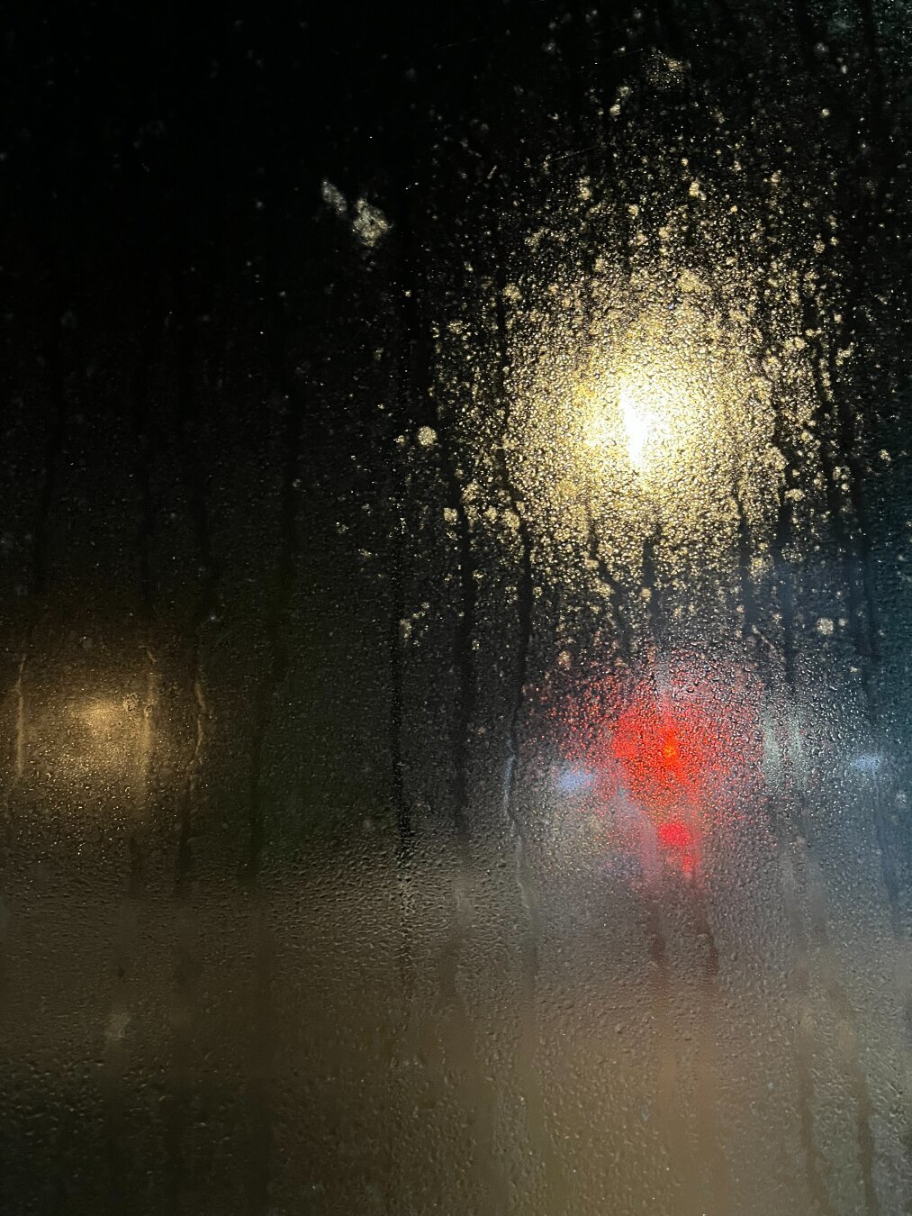 Night streetlight after a rainstorm.