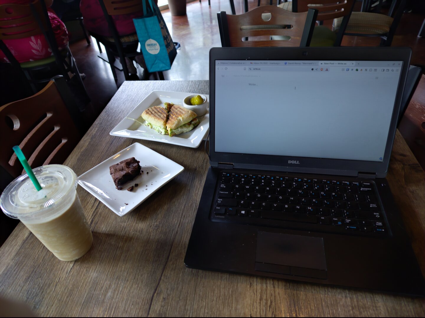 A workspace with coffee and snacks