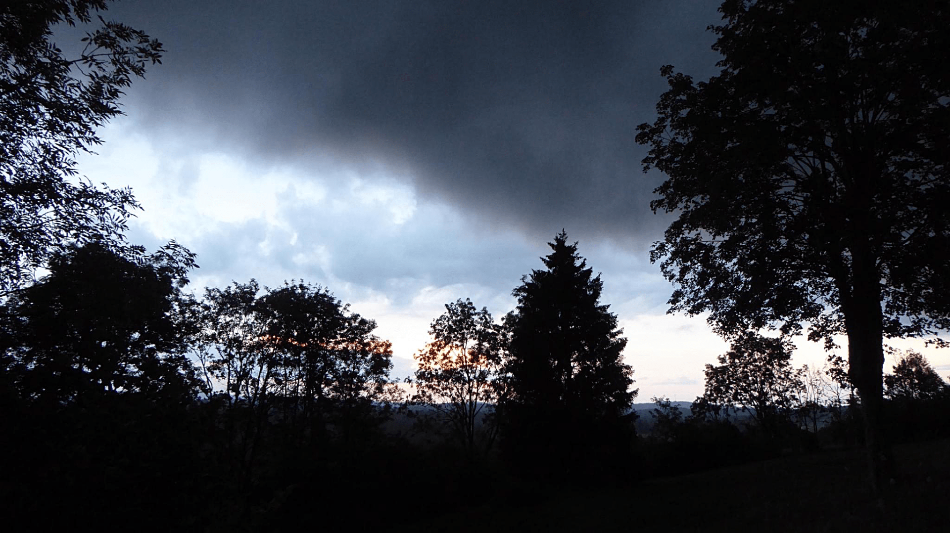 an image or two from my Pixelfed, shows a dramatic evening sky in the Jura, clouds hitting clear sky