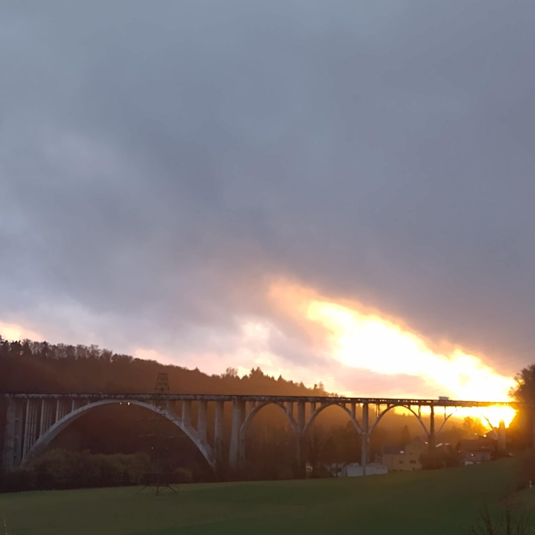 an image from my Pixelfed (because, fuck instagram), shows a bridge on a dramatic cloud night