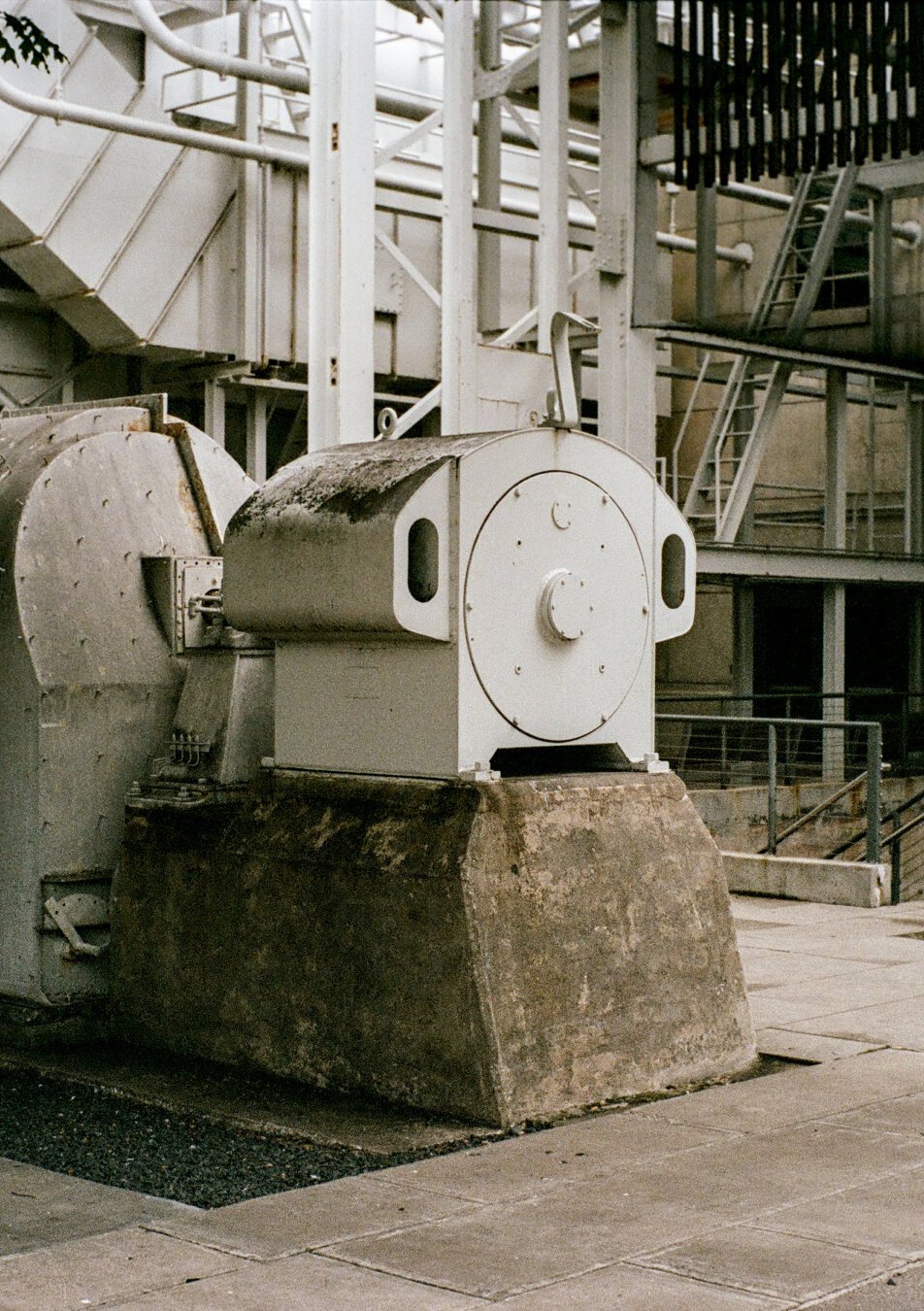 A big metal part that is somehow related to the old power plant. No clue what it is, but it is shaped like the profile of a mushroom and could use a coat of paint.