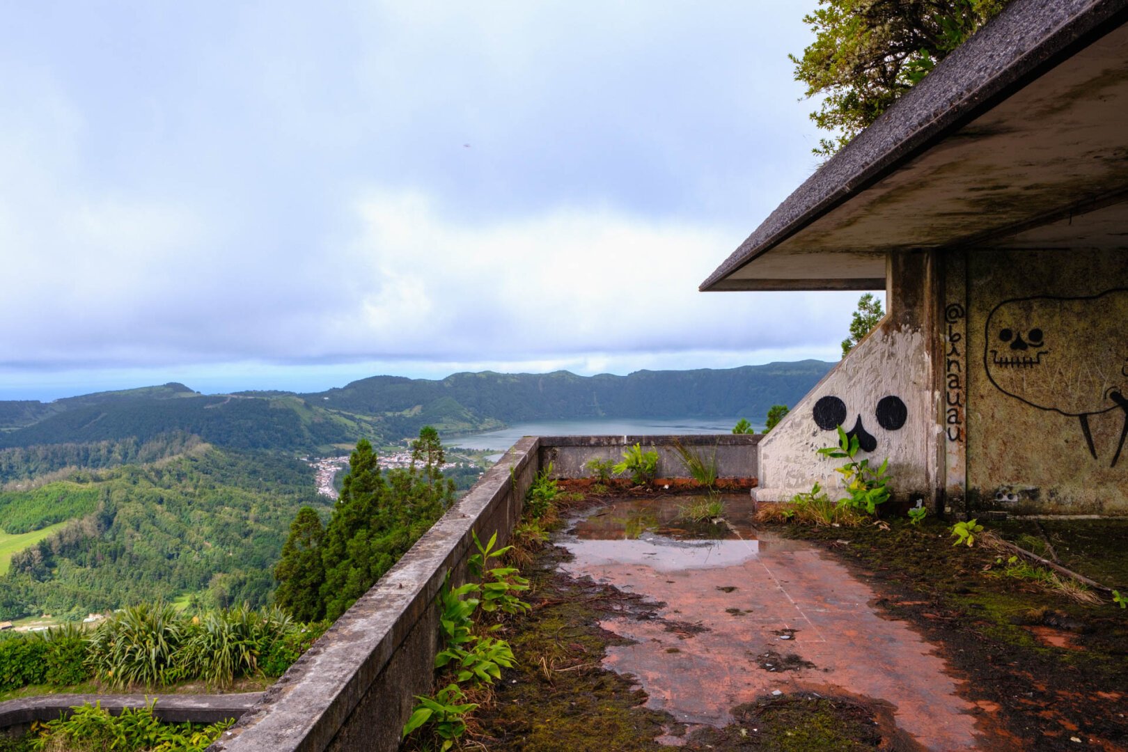 a building with a view of a valley and mountains