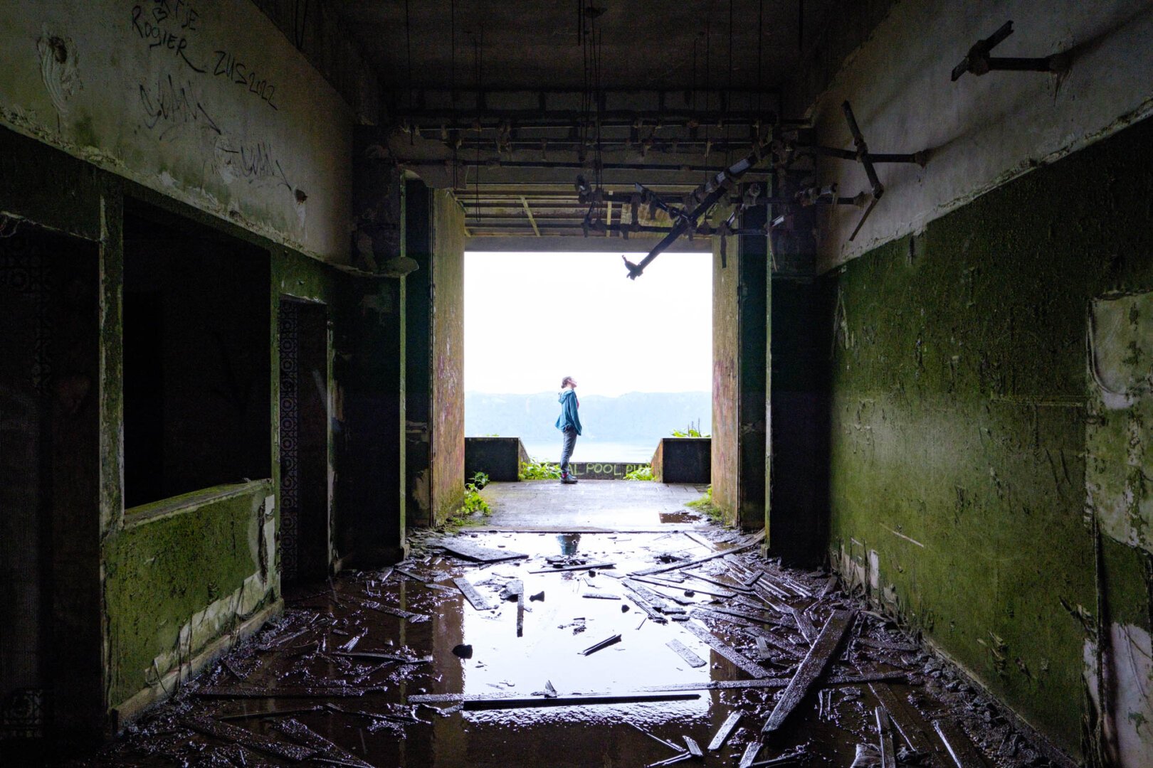 a person standing in an abandoned building