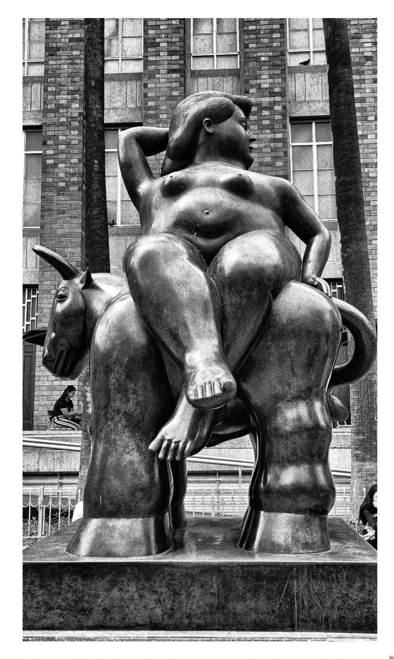 Statue of one of Fernando Botero's work: a full figured woman, depicting the Phoenician princess Europa, sitting on a bull.