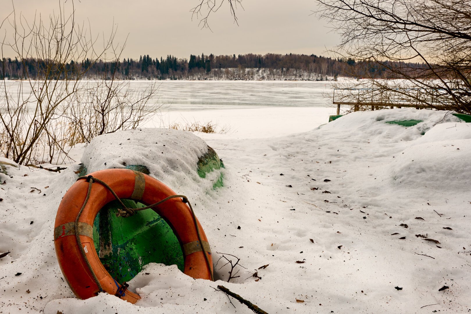 The boat upside down in the snow.