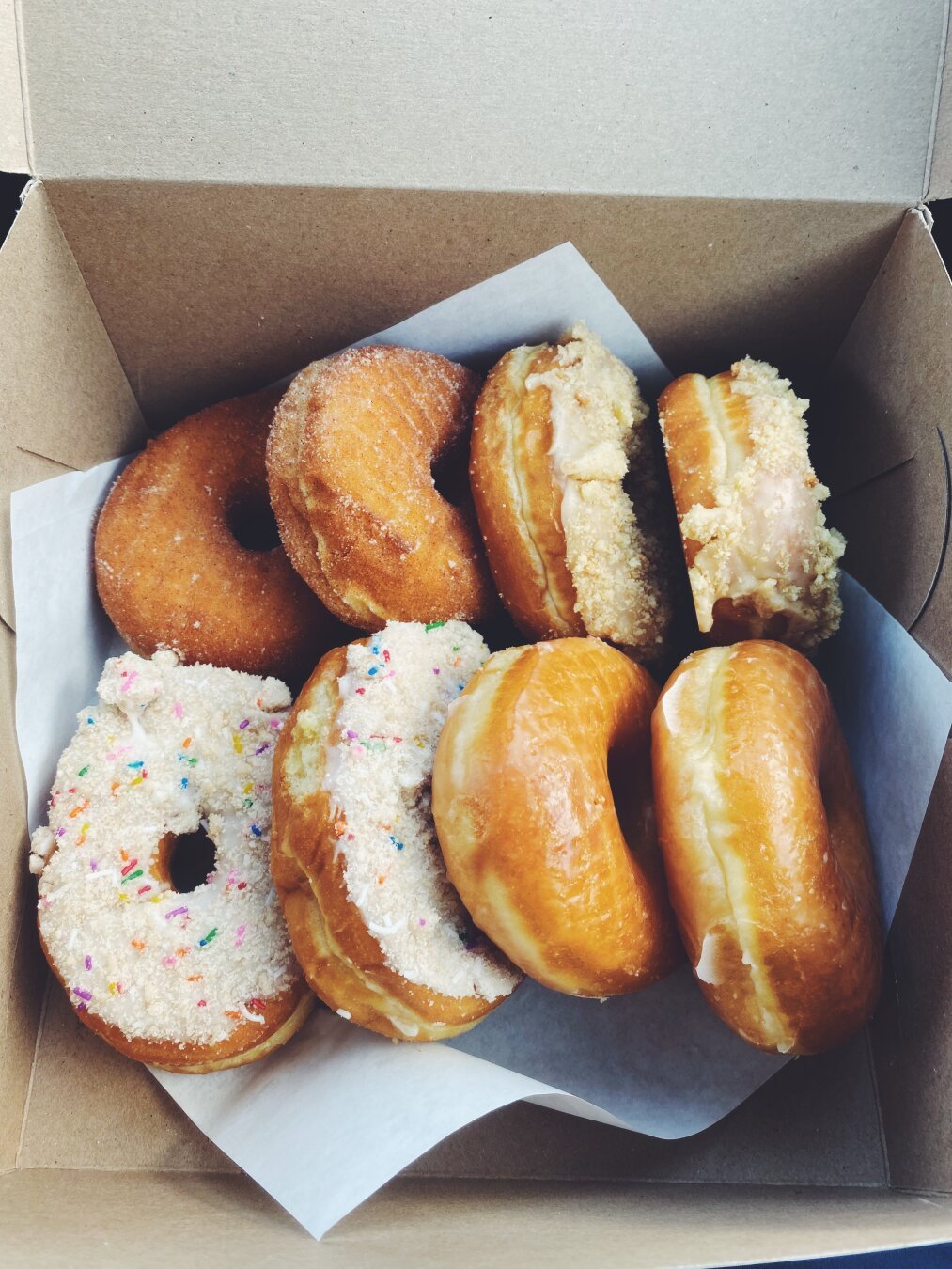 A box with 8 donuts inside