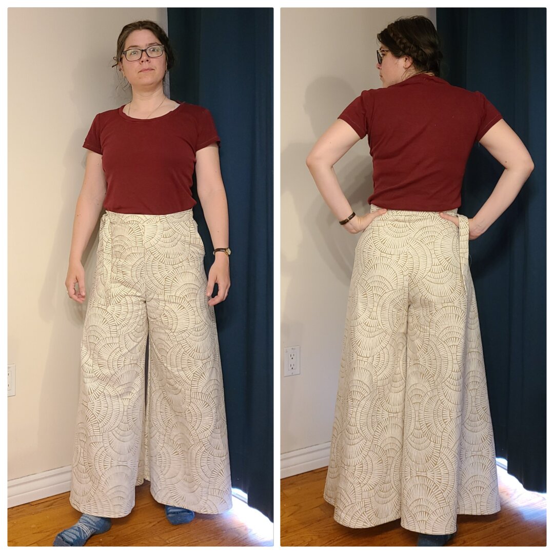 A woman wearing a pants with dramatic flaring legs in a large geometric print in cream and taupe.

She's viewed from the front and the back in side by side images