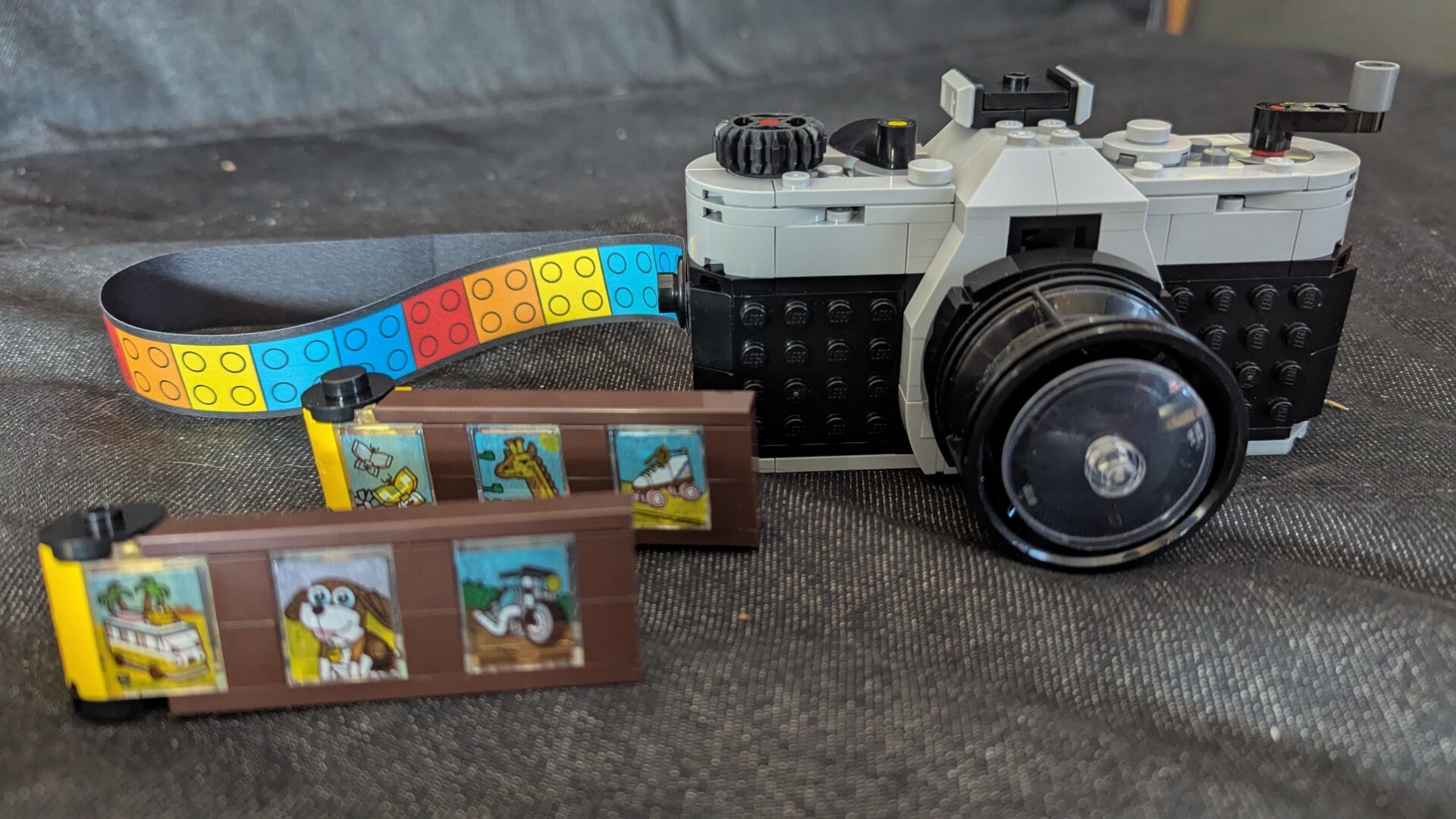 Lego film camera from the front with Lego film on the left.