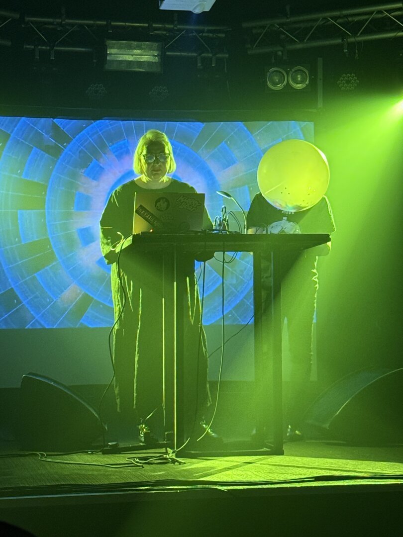 Kylie Monologue, duo with electronic gear on stage and video projection behind them