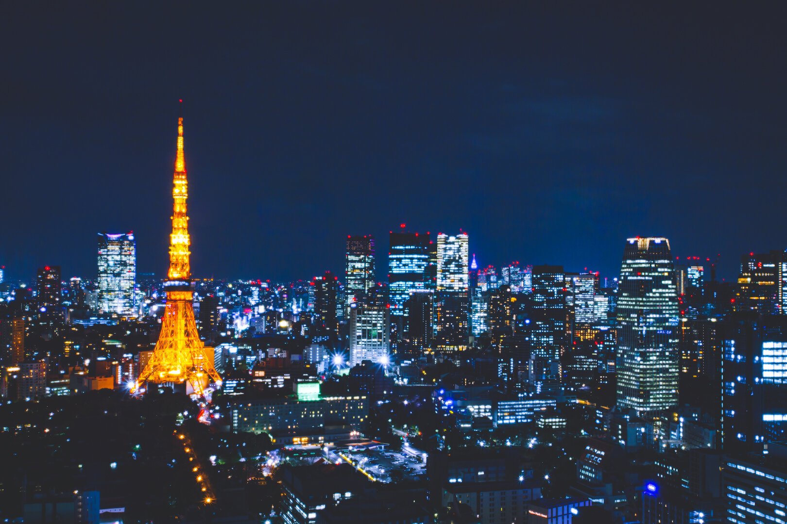 Skyline with the illuminated Tokyo tower at night.