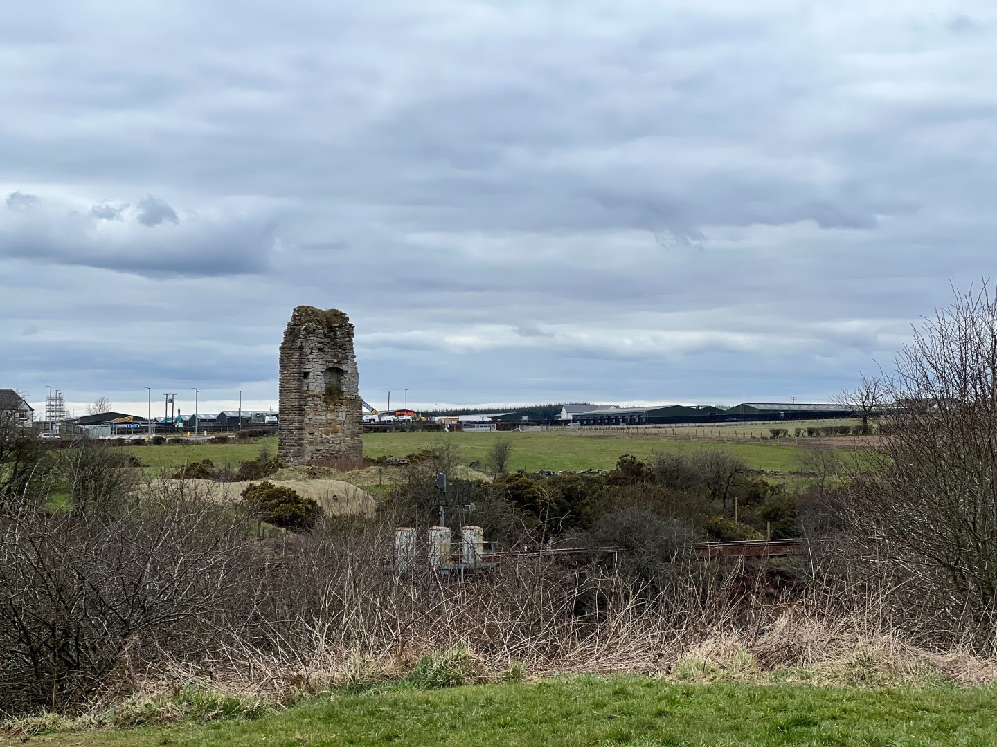 Ruins of Corsehill Castle in a field.