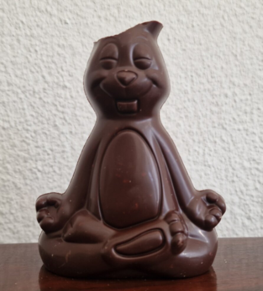 Dark chocolate easter bunny with chopped off ears.