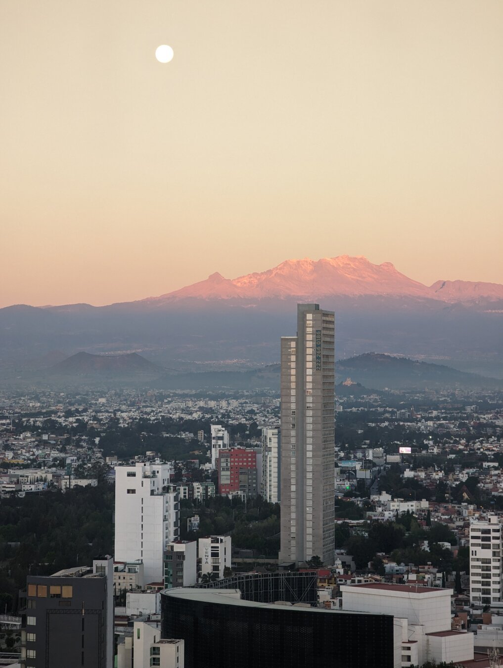 Rising sun and setting moon over Puebla, MX