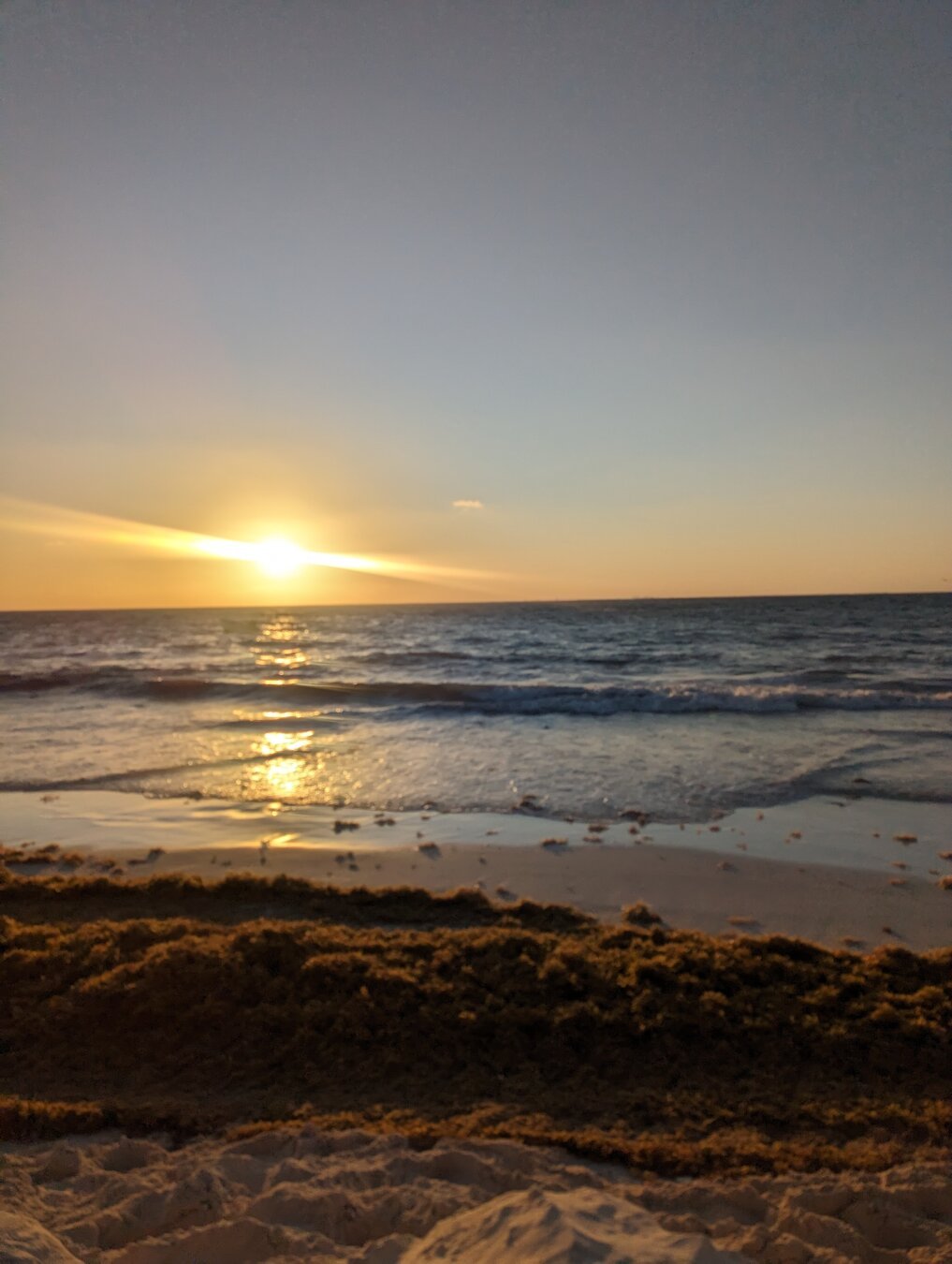 Sunrise looking over the Caribbean toward Cozumel from the beach at Playa del Carmen