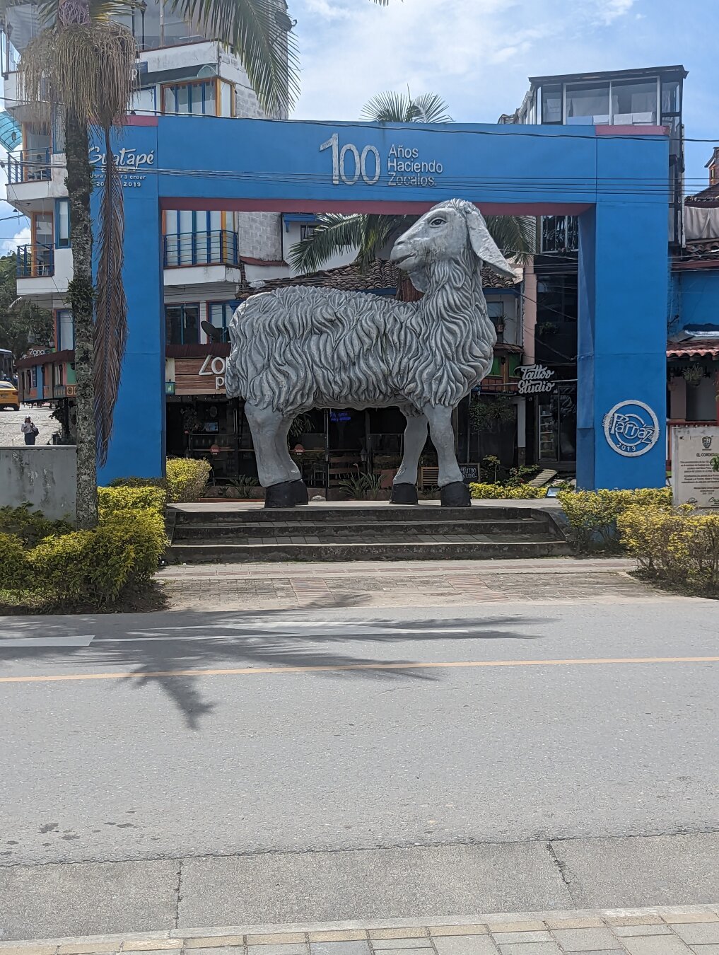 A large, stone sculpture of a llama