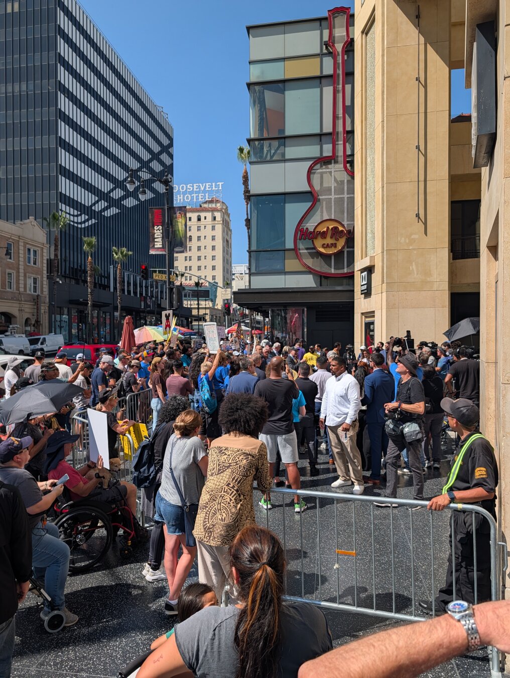 A crowd of people in front of the Dolby theater in Hollywood, California, in support of Jimmy Kimmel.