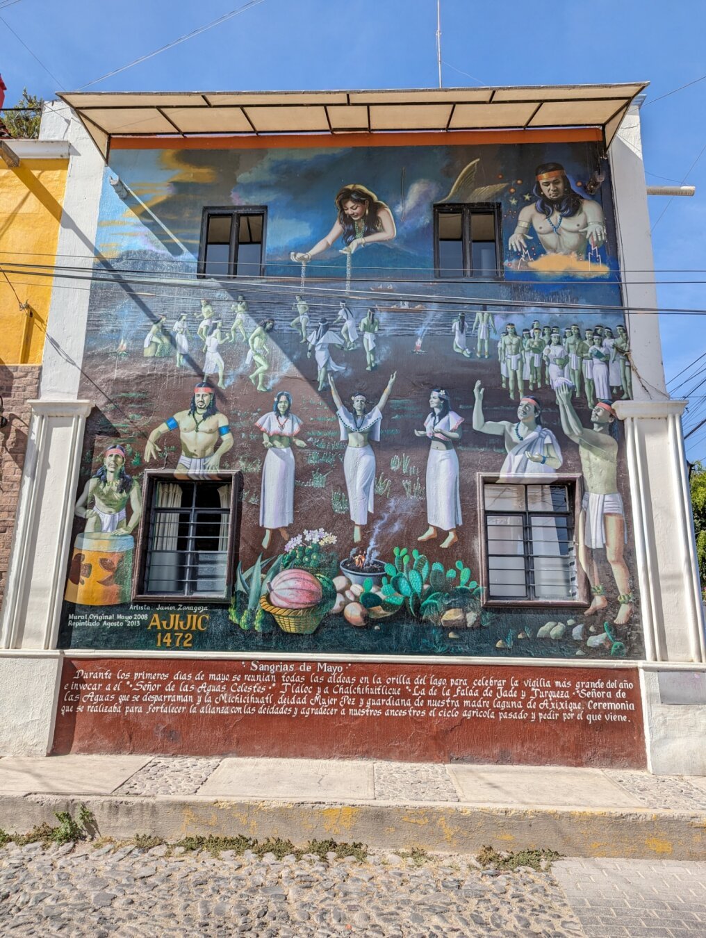 A 2-storey mural of pre-colonial Mexicans making offerings to the gods.