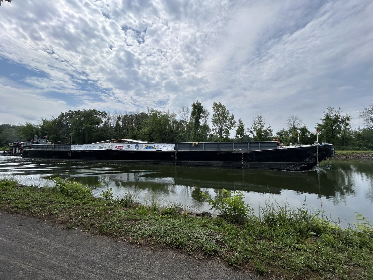 Barge on the Erie canal. Clouds in the sky.