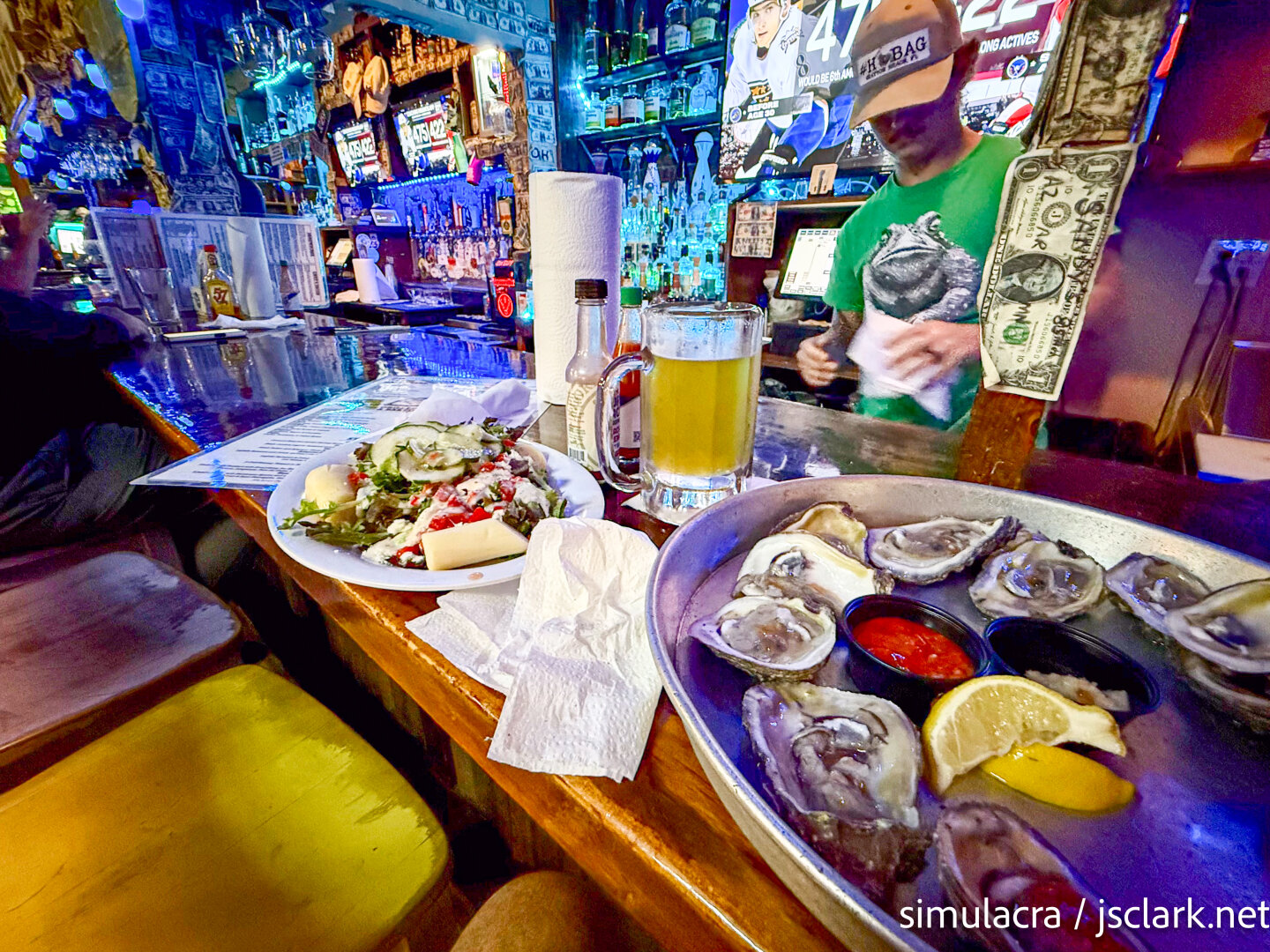 Salad with hearts-of-palm, a dozen raw oysters, quirky bar with dollar bills stapled everywhere.