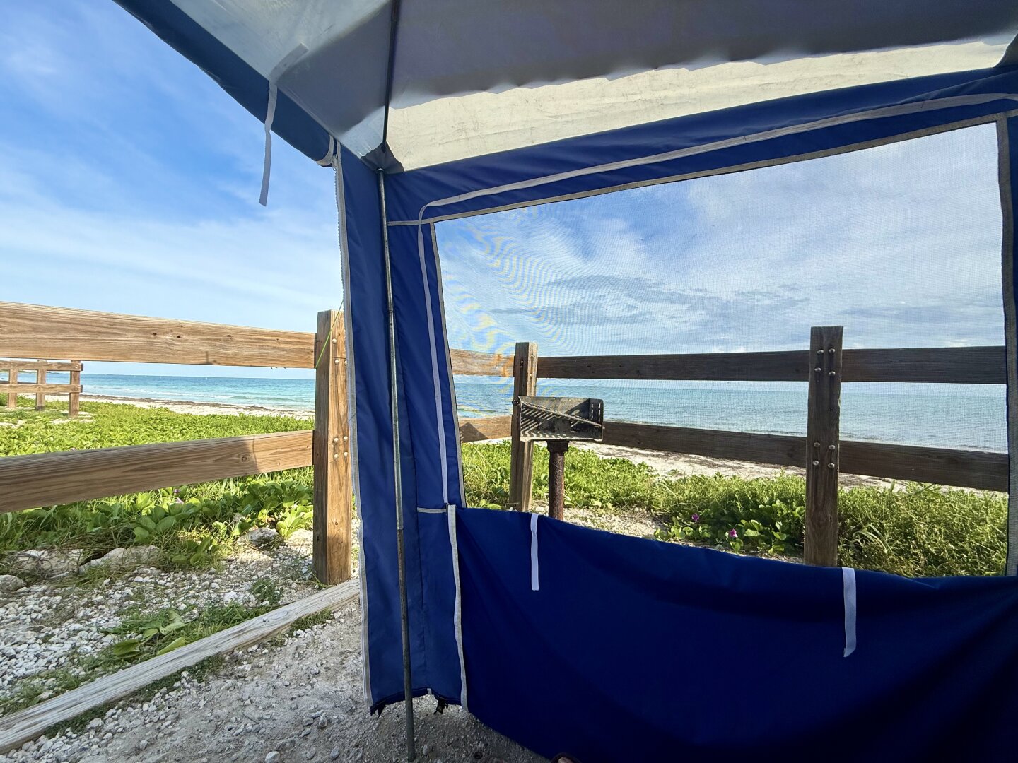 View of calm Atlantic from a tent camping spot at Bahia Honda.