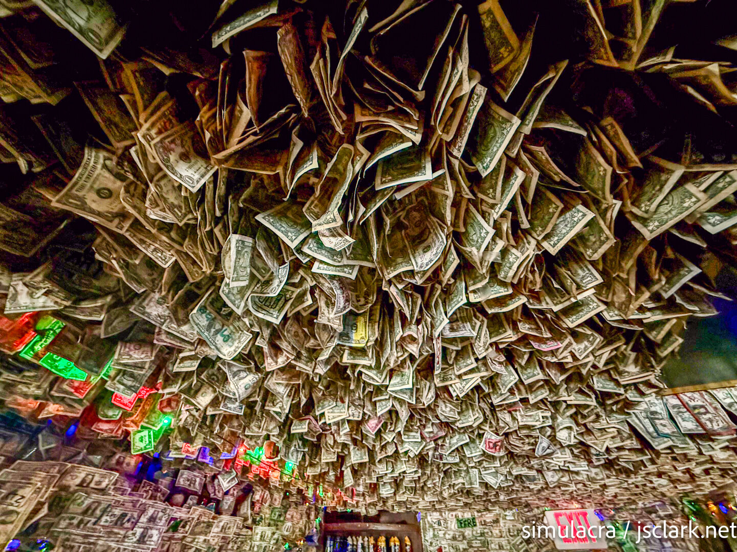 Hundreds of dollar bills stapled to a pub ceiling.