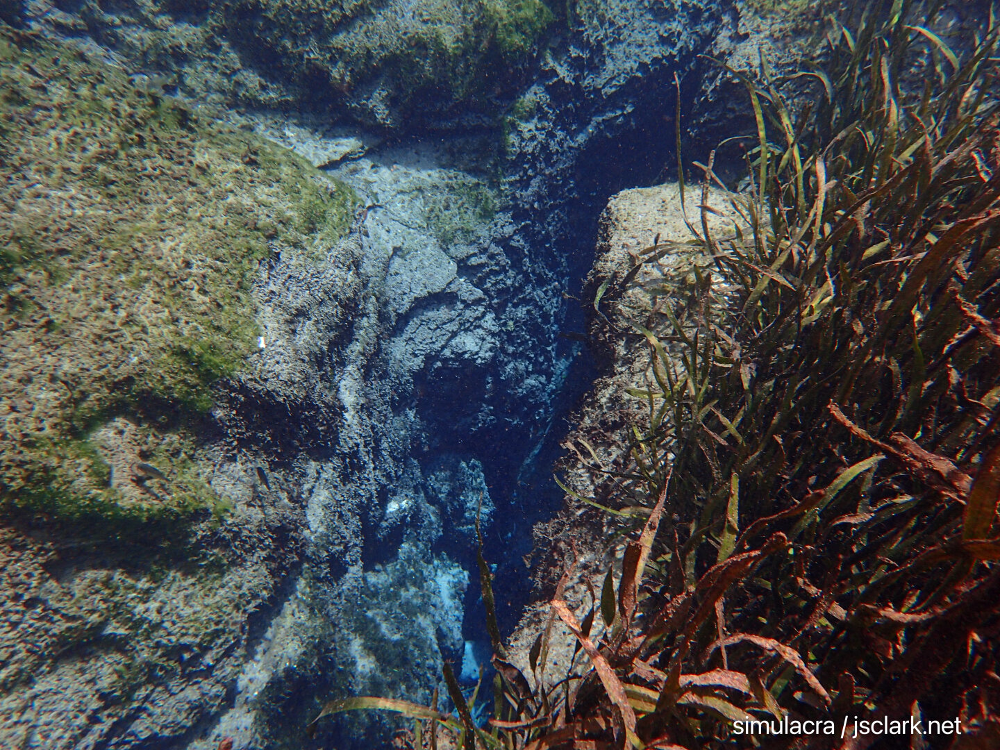 A deep limestone fissure in the bottom.
