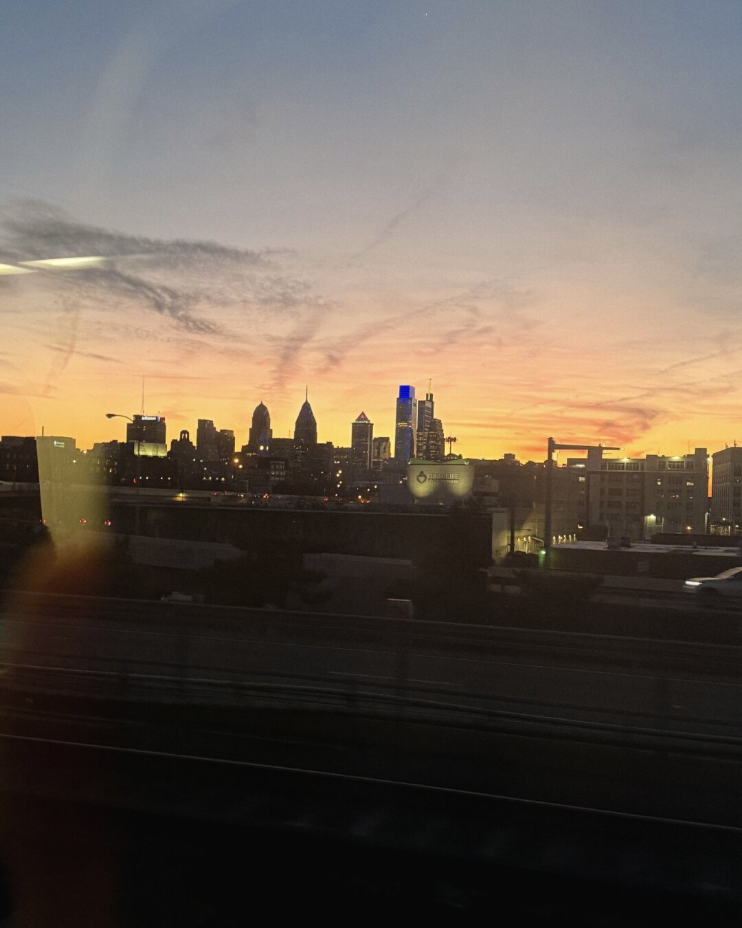 The Philadelphia skyline seen from the east with a sunset in the background