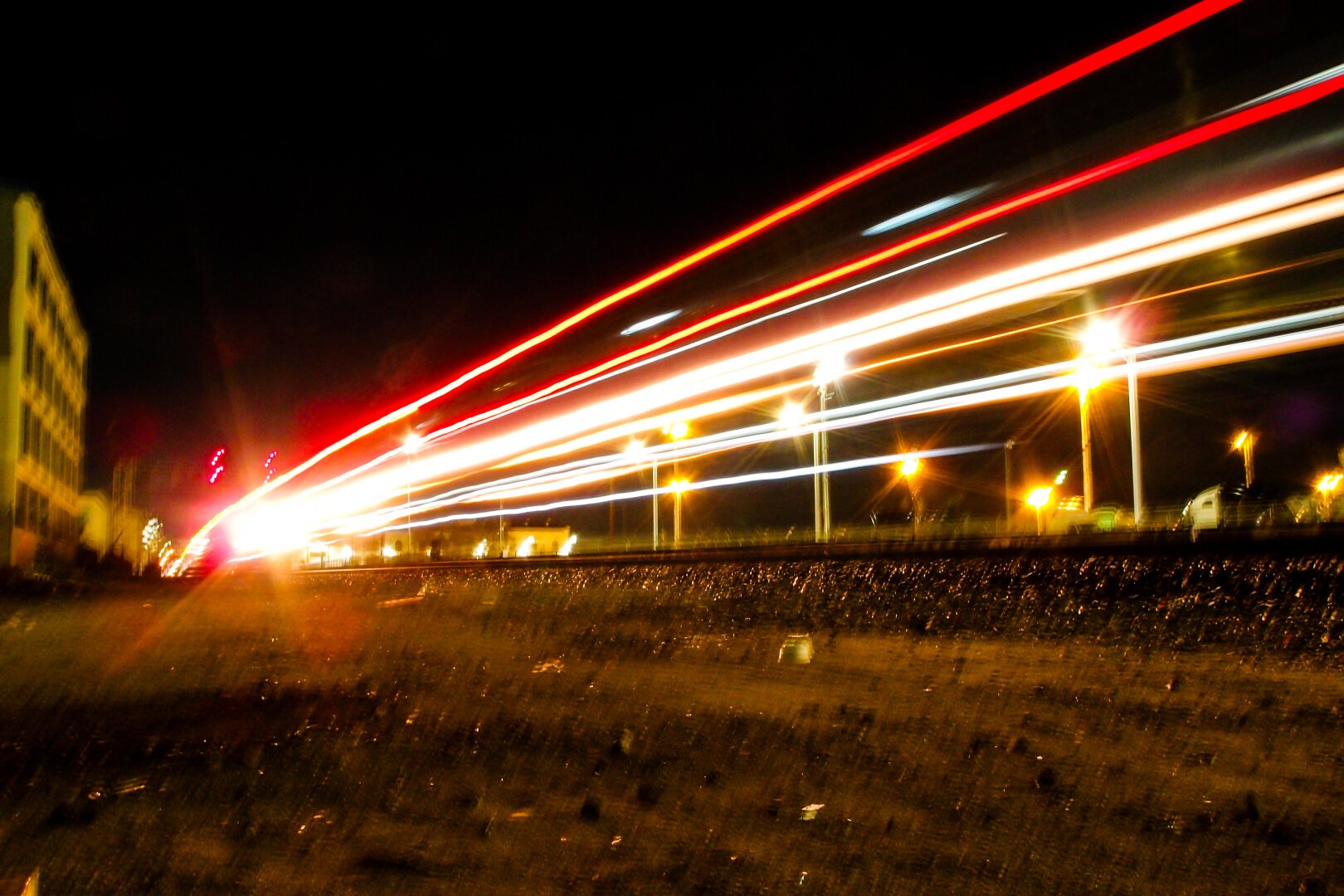 Streams of light, train cars.