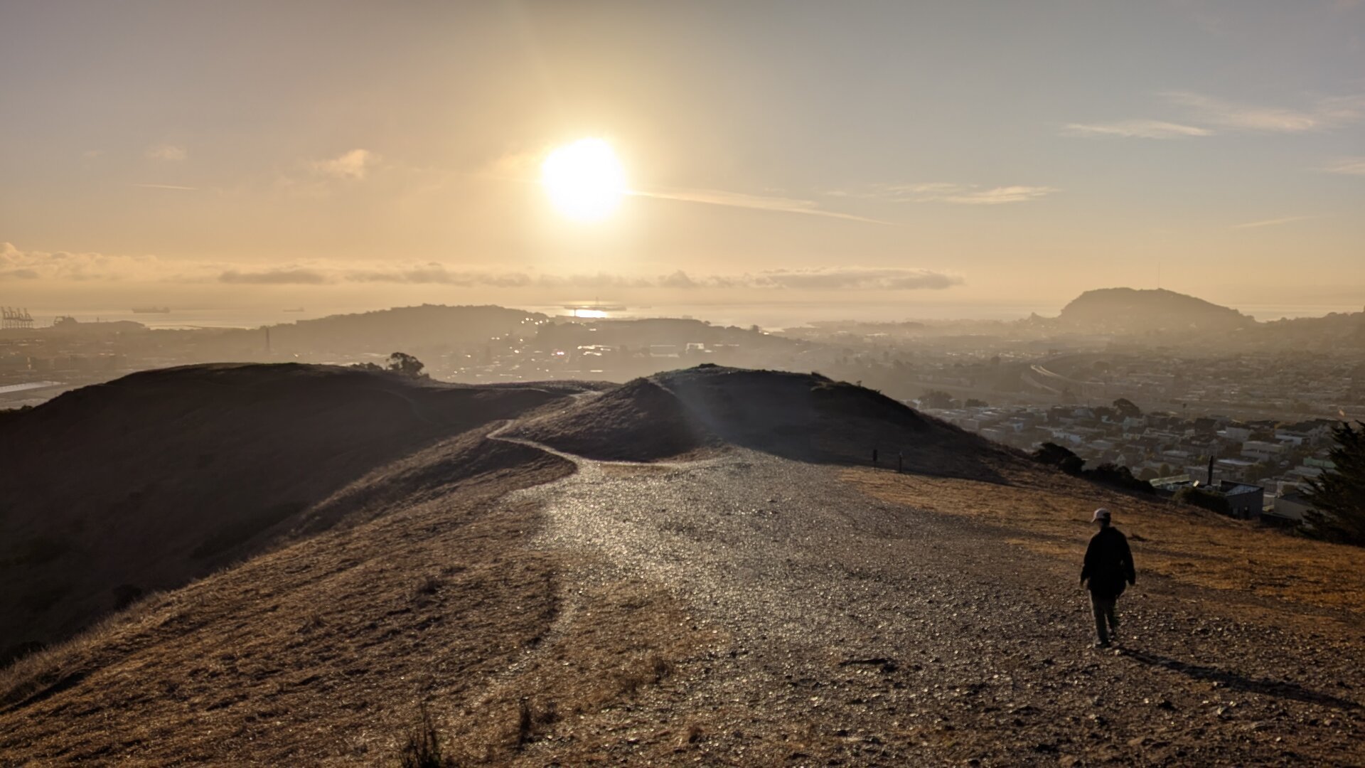 Sun rises over gravel wet from last night's rain