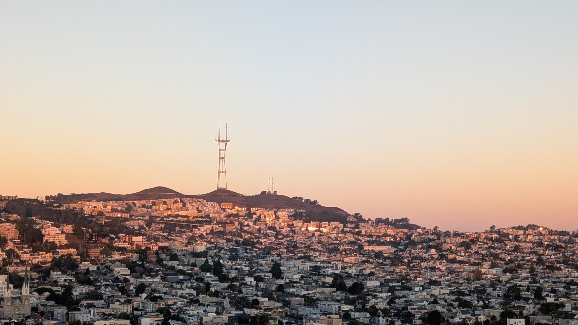 orange haze surrounds communication tower