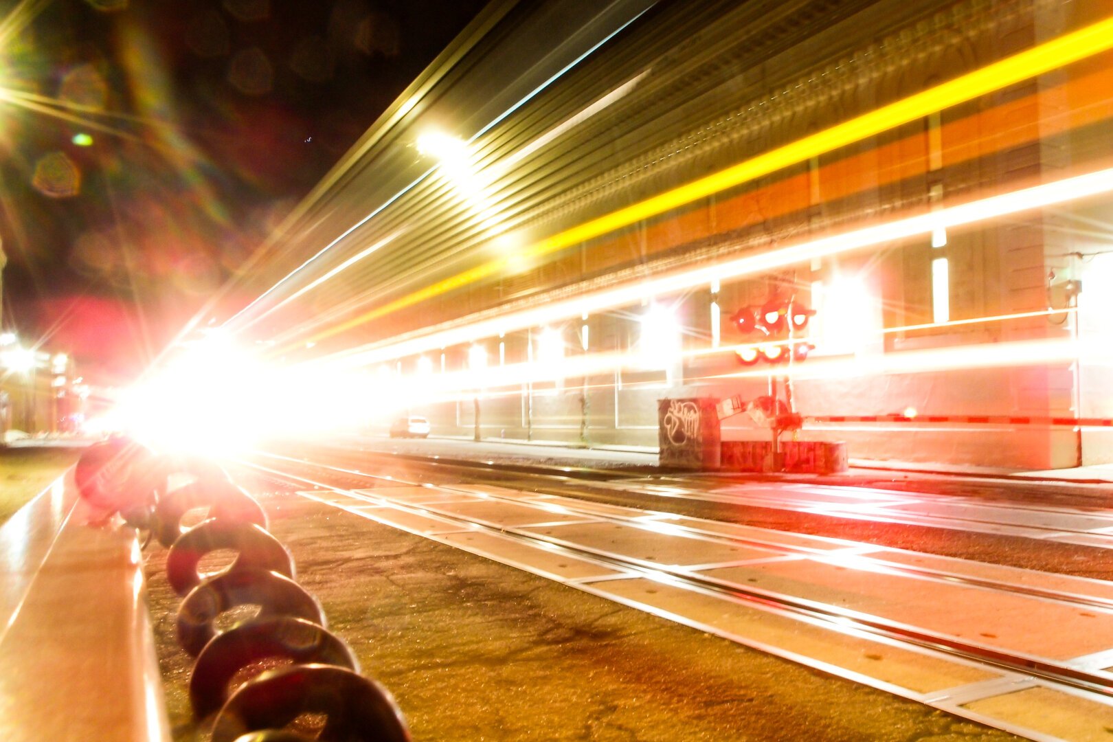 Streams of pastel light from a train passing.