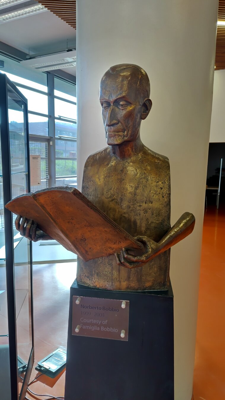 Statue of Norberto Bobbio at entrance of a library of the University of Turin