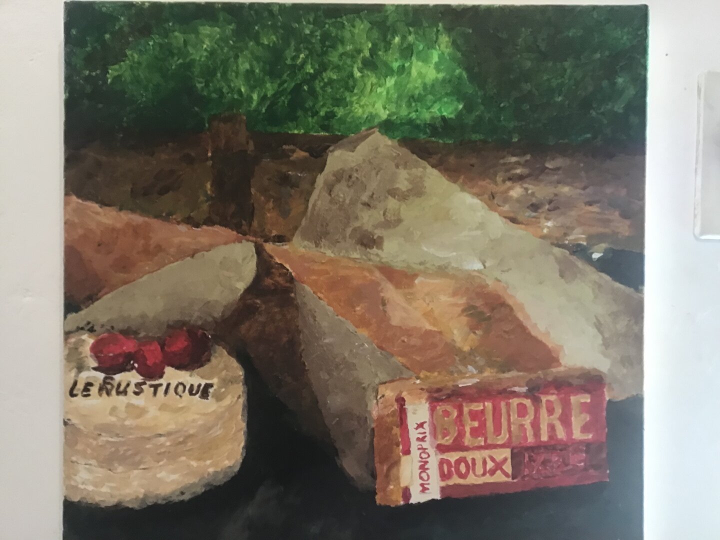 Painting in acrylic. Can see butter, bread, cheese.