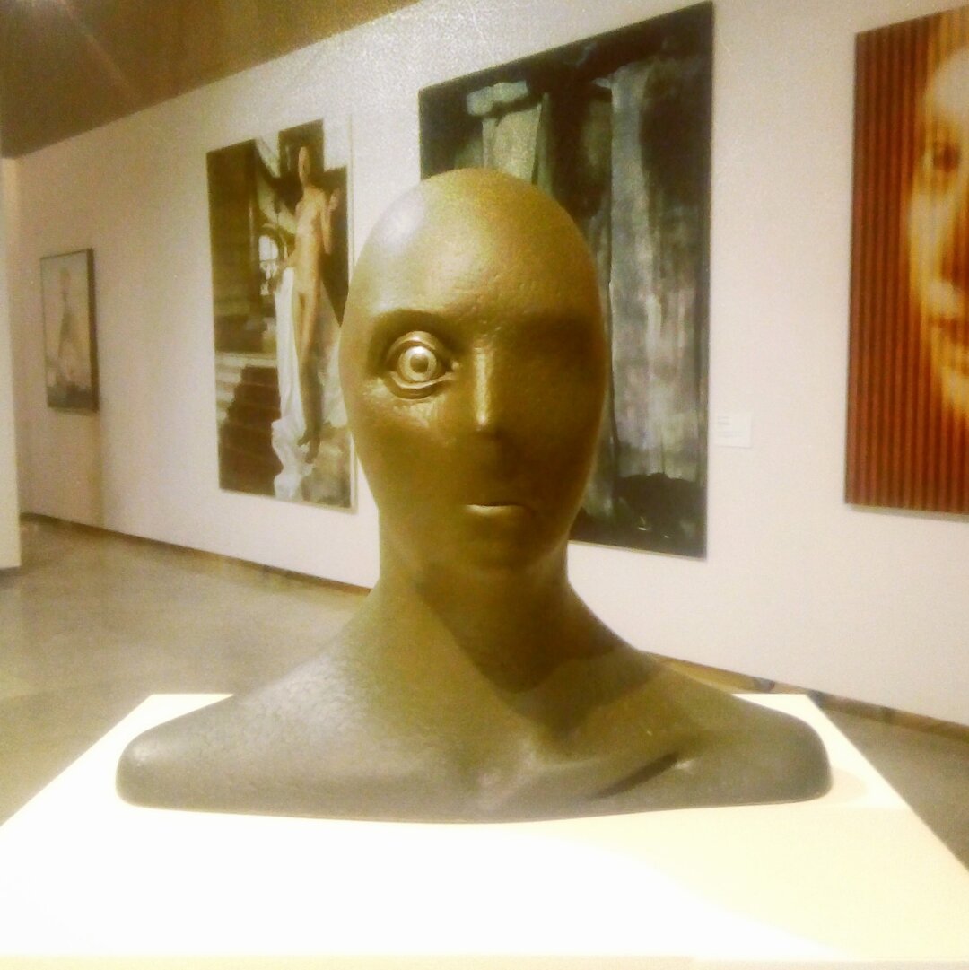 A bust of one-eyes human in bronze color