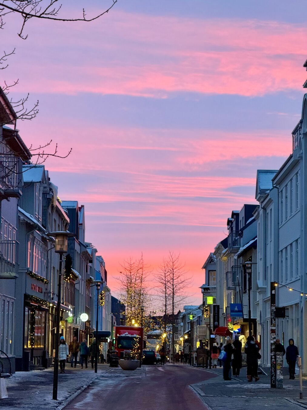 A pink sunrise over a part of Laugavegur in downtown Reykjavík
