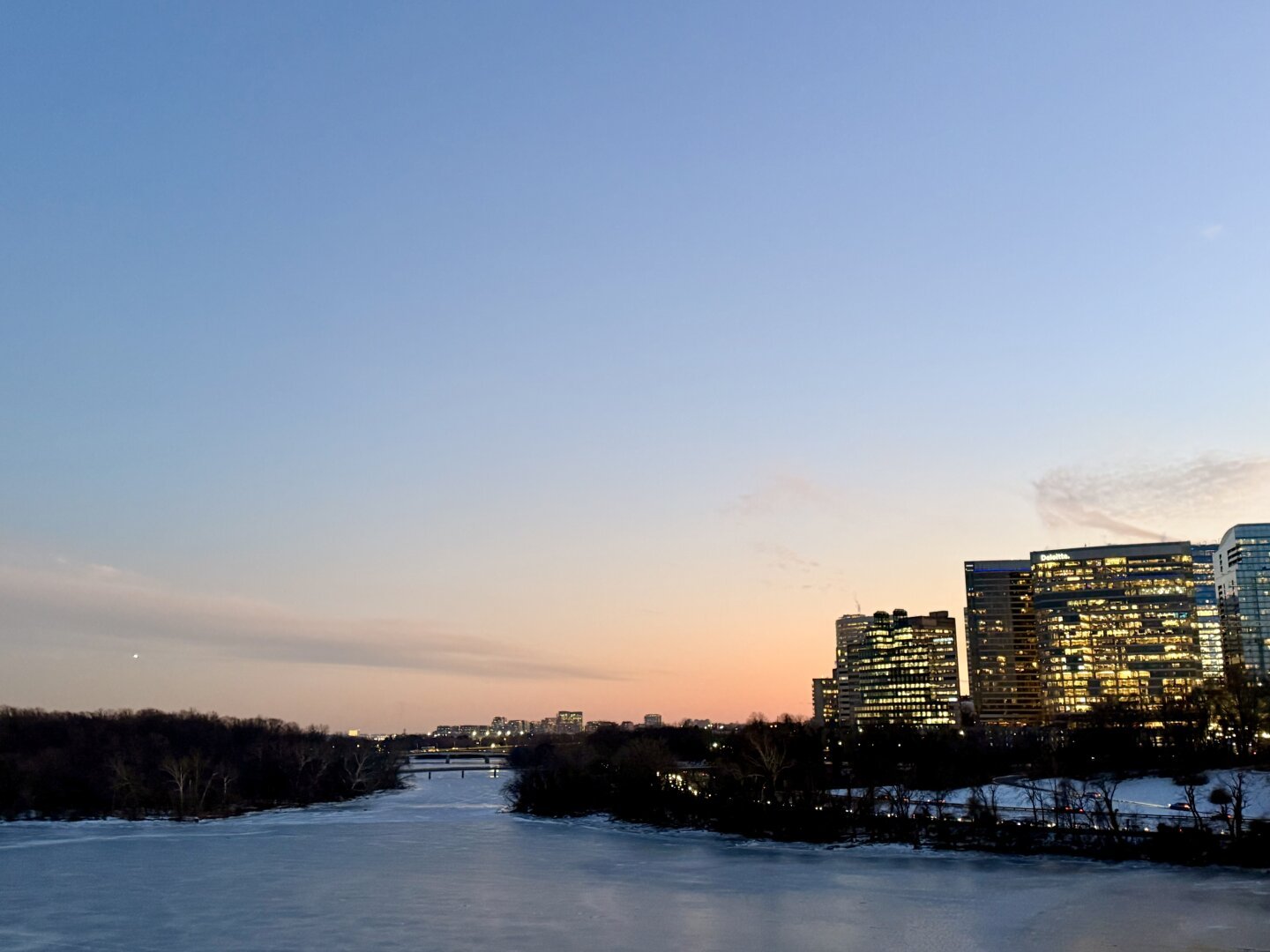 Office buildings in Rosslyn are seen from the Key Bridge as the sunset colors fade behind them