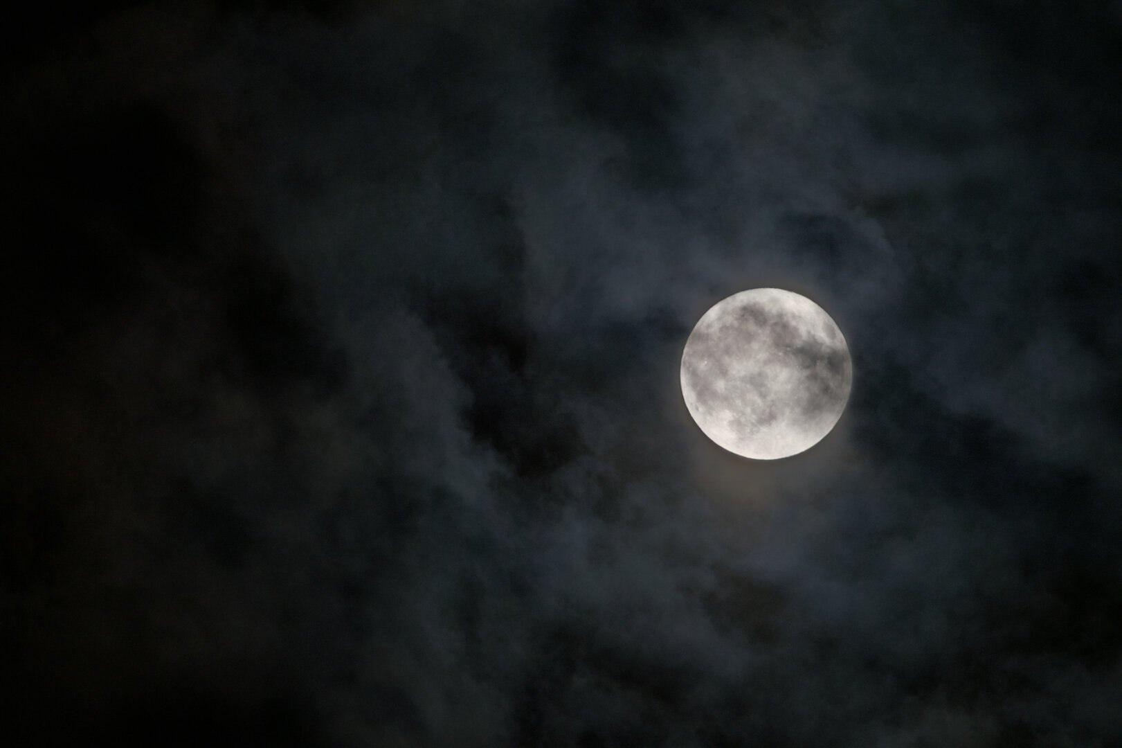 moon behind clouds