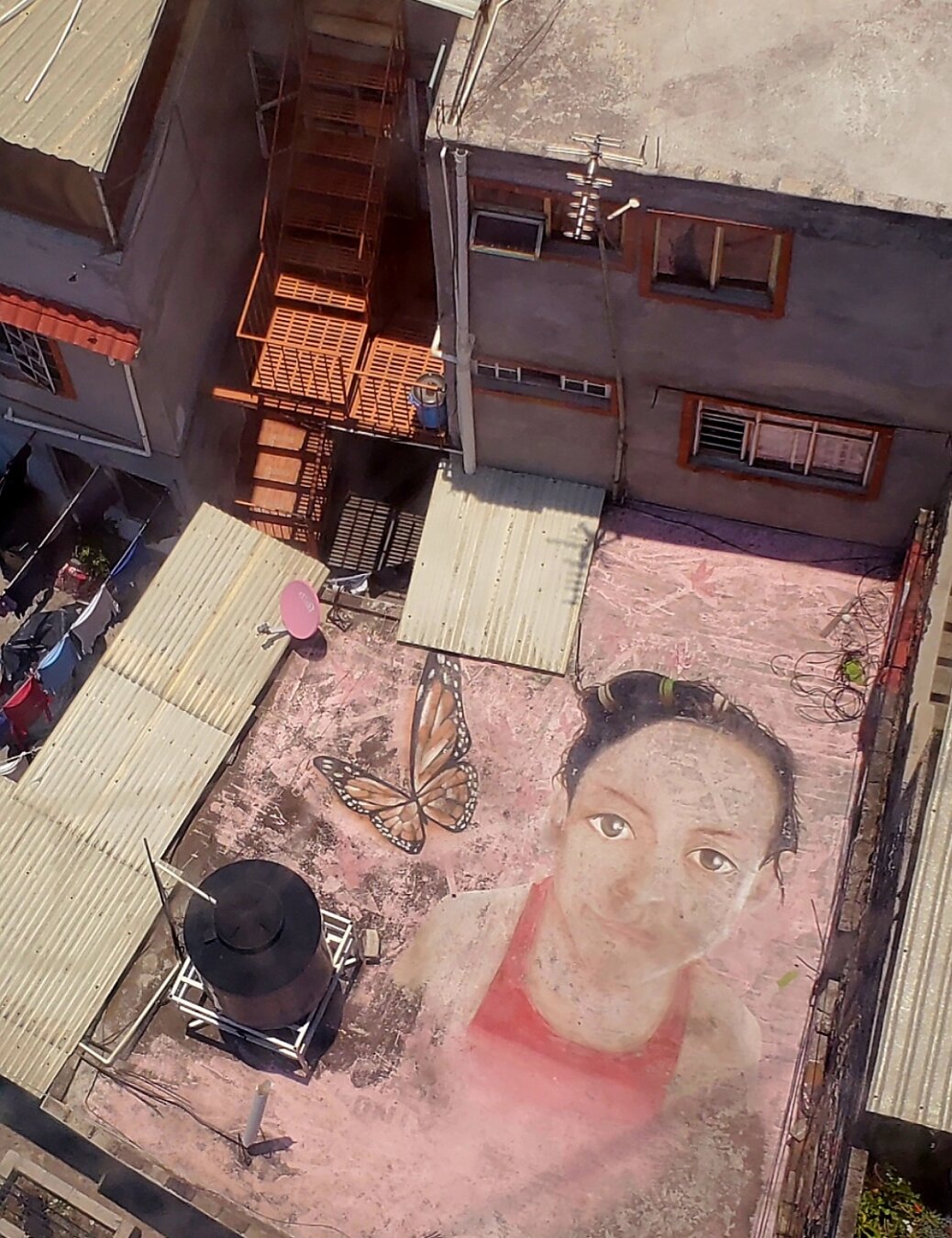 Artwork by unknown artist visible from the Cablebús gondolas as they glide over Iztapalapa in Mexico City