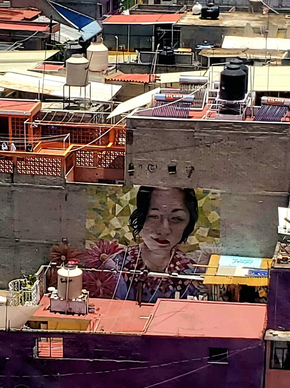 Artwork by unknown artist visible from the Cablebús gondolas as they glide over Iztapalapa in Mexico City