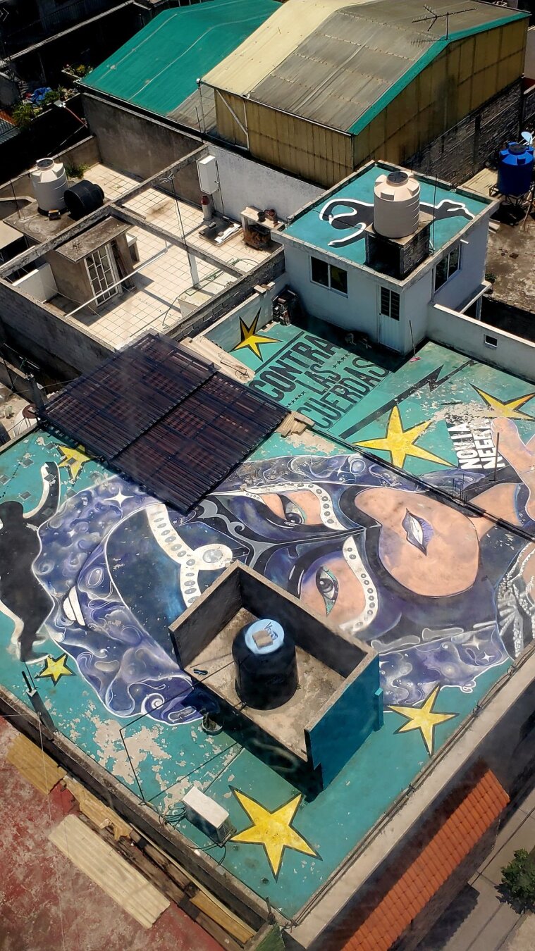 Artwork by unknown artist visible from the Cablebús gondolas as they glide over Iztapalapa in Mexico City
