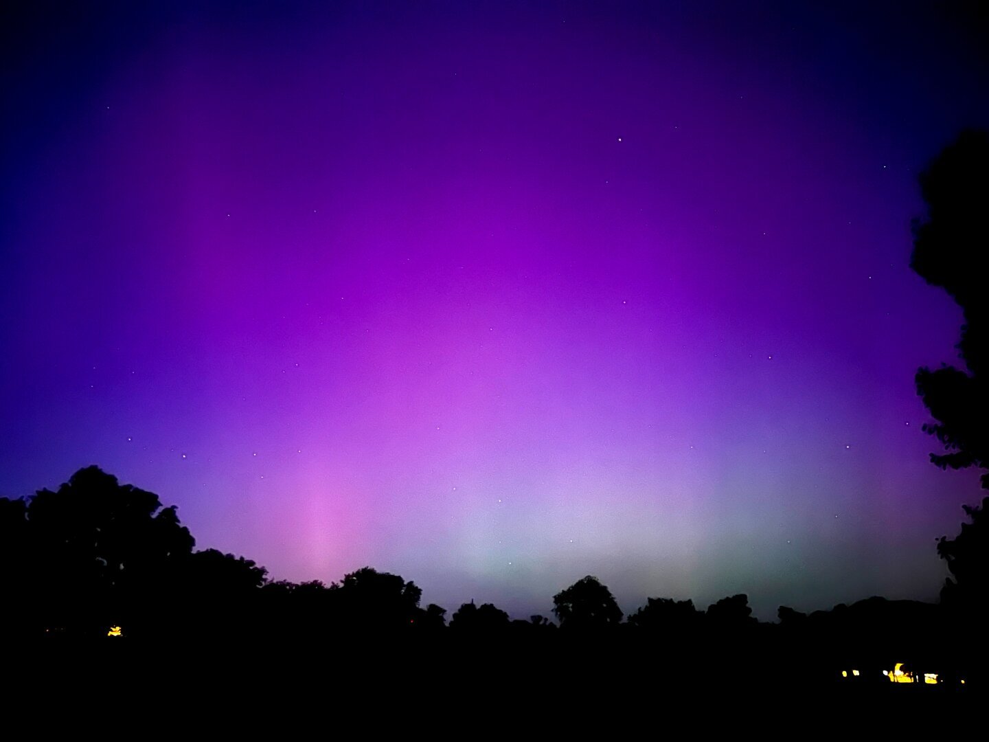 Purple and green aurora as seen from central Kansas, just after sunset